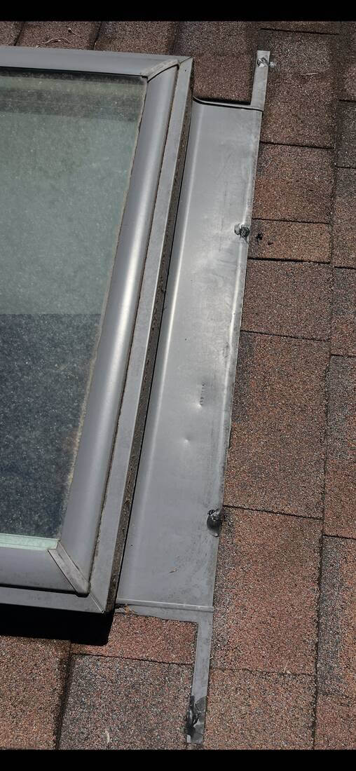 After: Skylight Flashing — Skylight flashing refastened and resealed at every penetration point.