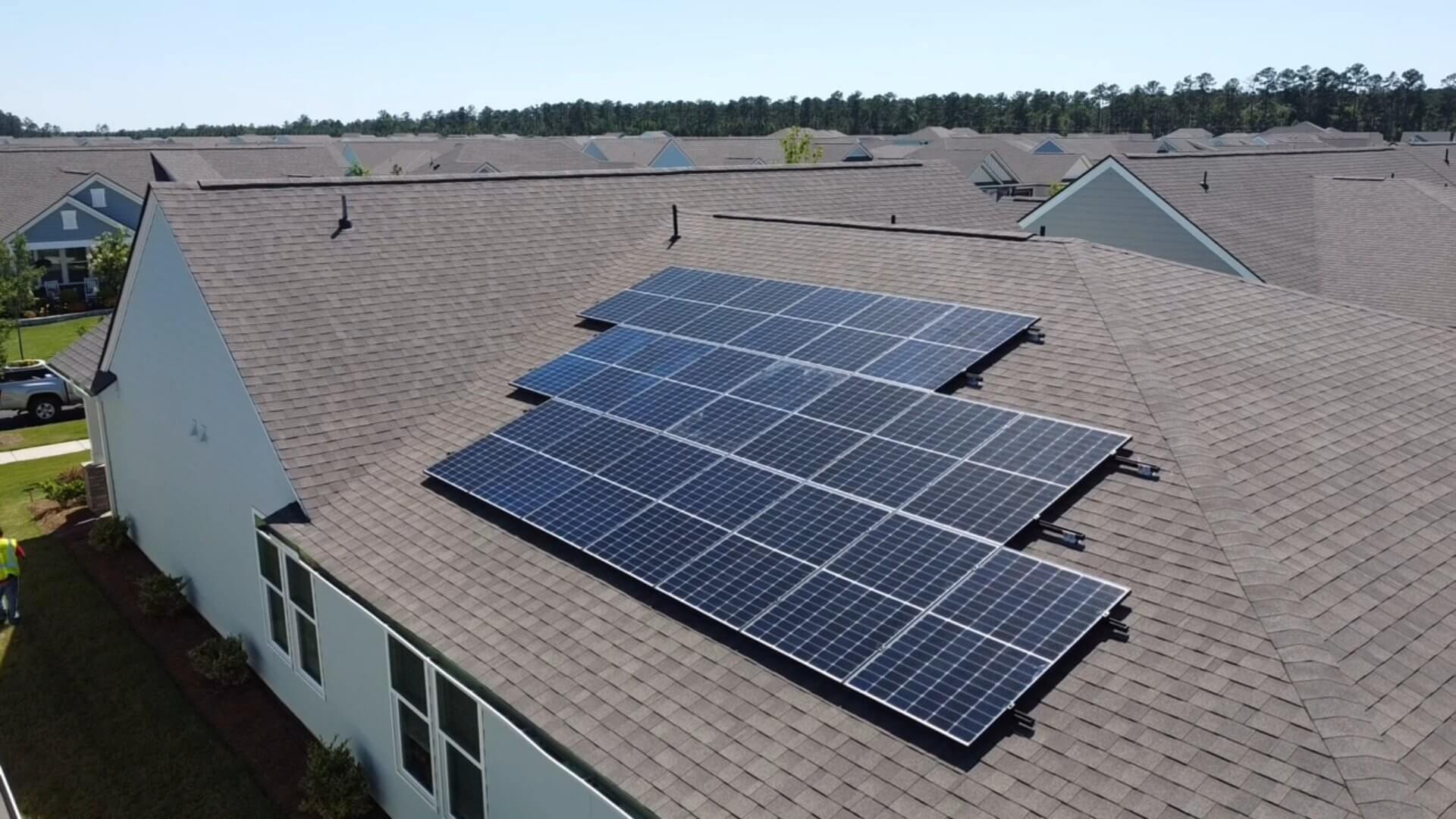 Close-up of solar panels being installed on a roof