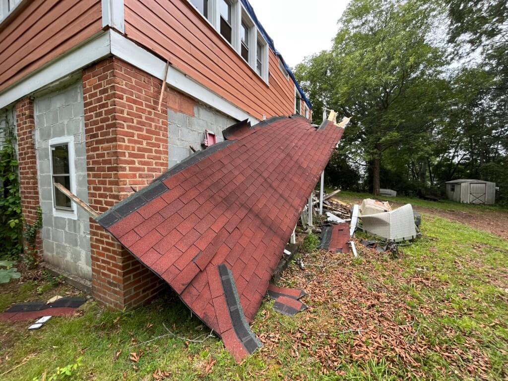Storm damage to the roof before Affordable Roofing SC responded