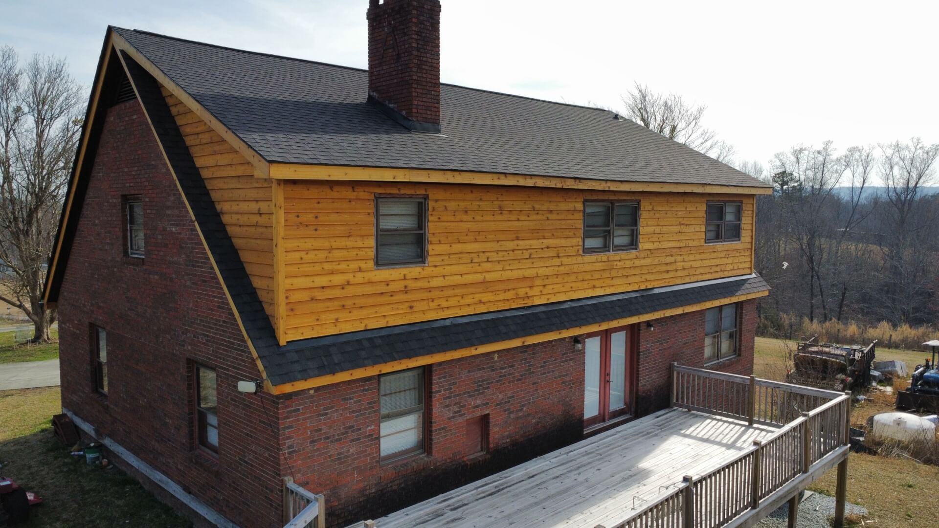 The same Upstate SC home after new roof shingles and cedar dormer siding were installed