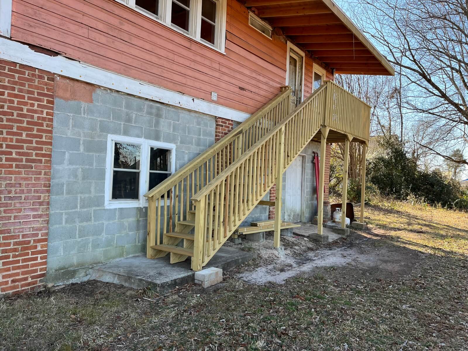 Rebuilt exterior stairway and landing on the same Upstate SC home after repair work was completed